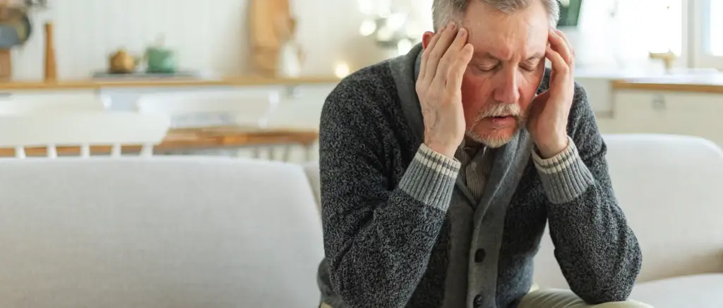 Old man with expression of pain