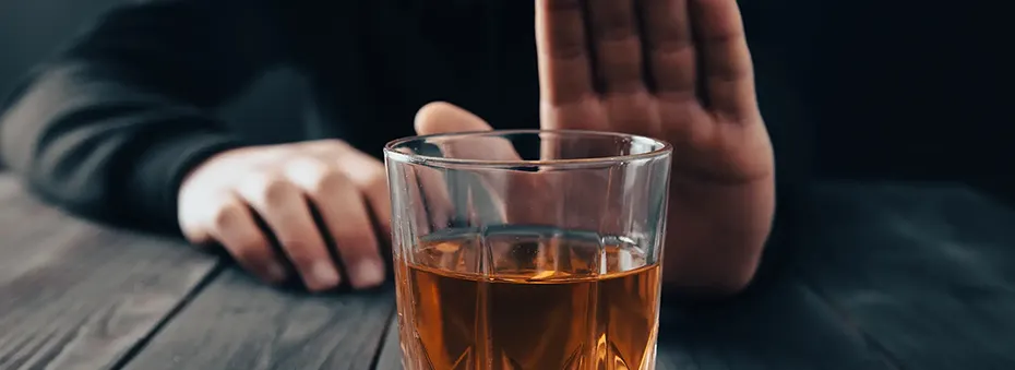 man rejecting a drink