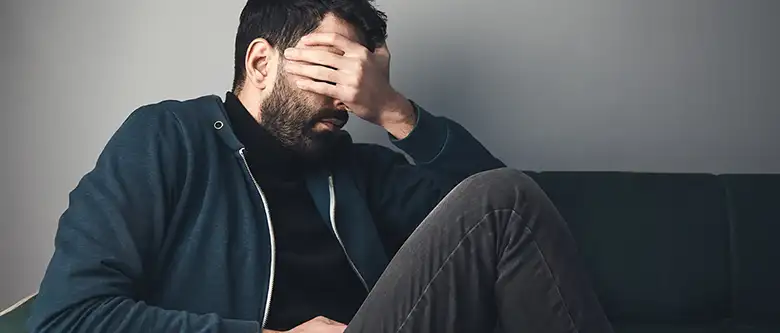 Sad man covered.