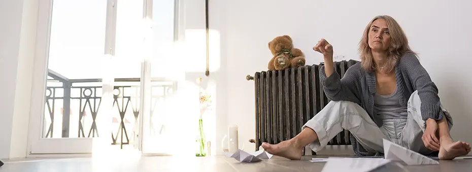 woman sitting down thinking