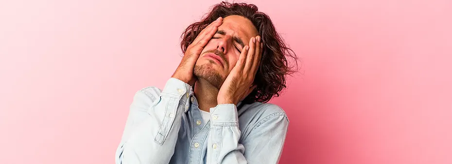 man holding his head