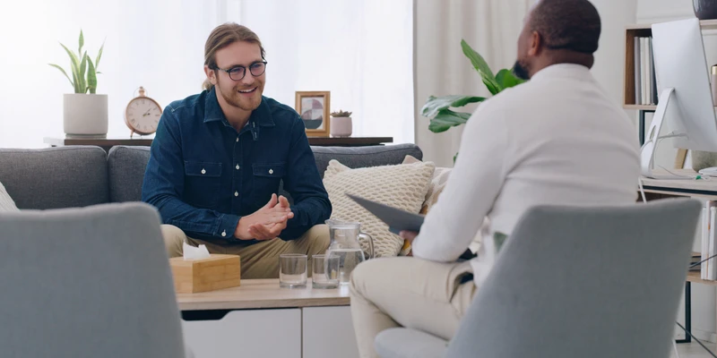 black man talking psychologist patient mental health support