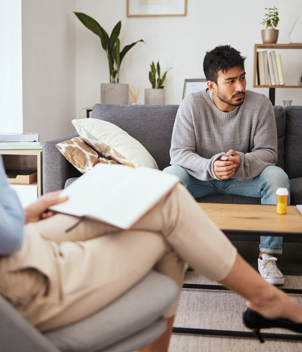depression psychologist talking man patient sofa medical support