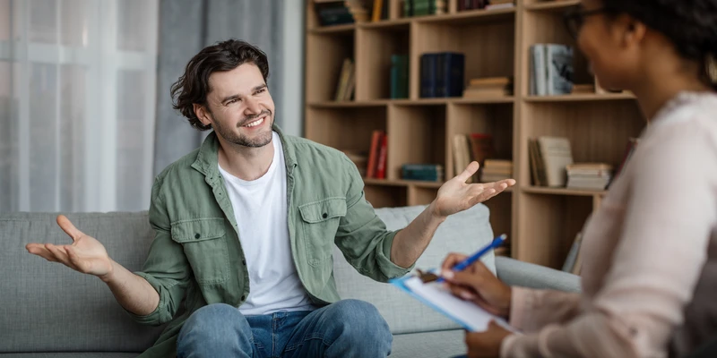 glad happy millennial caucasian male client meeting with