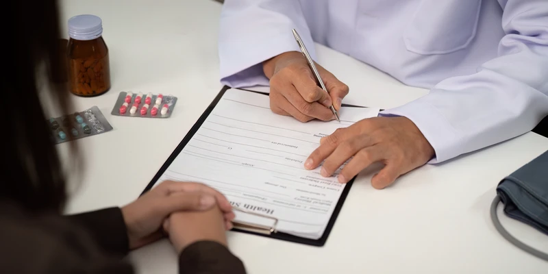 medical documentation patient interaction doctor filling out patient