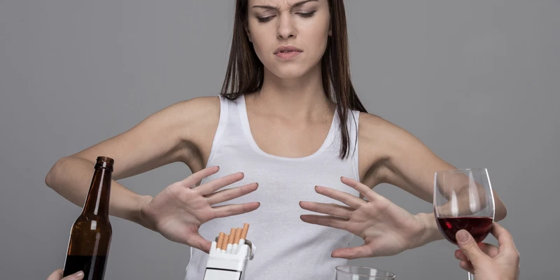 young woman who refuses alcohol tobacco